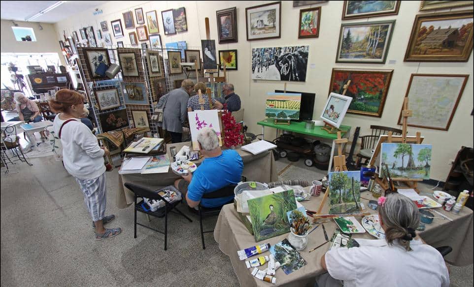 Members painting in Florida Wildflower Studios