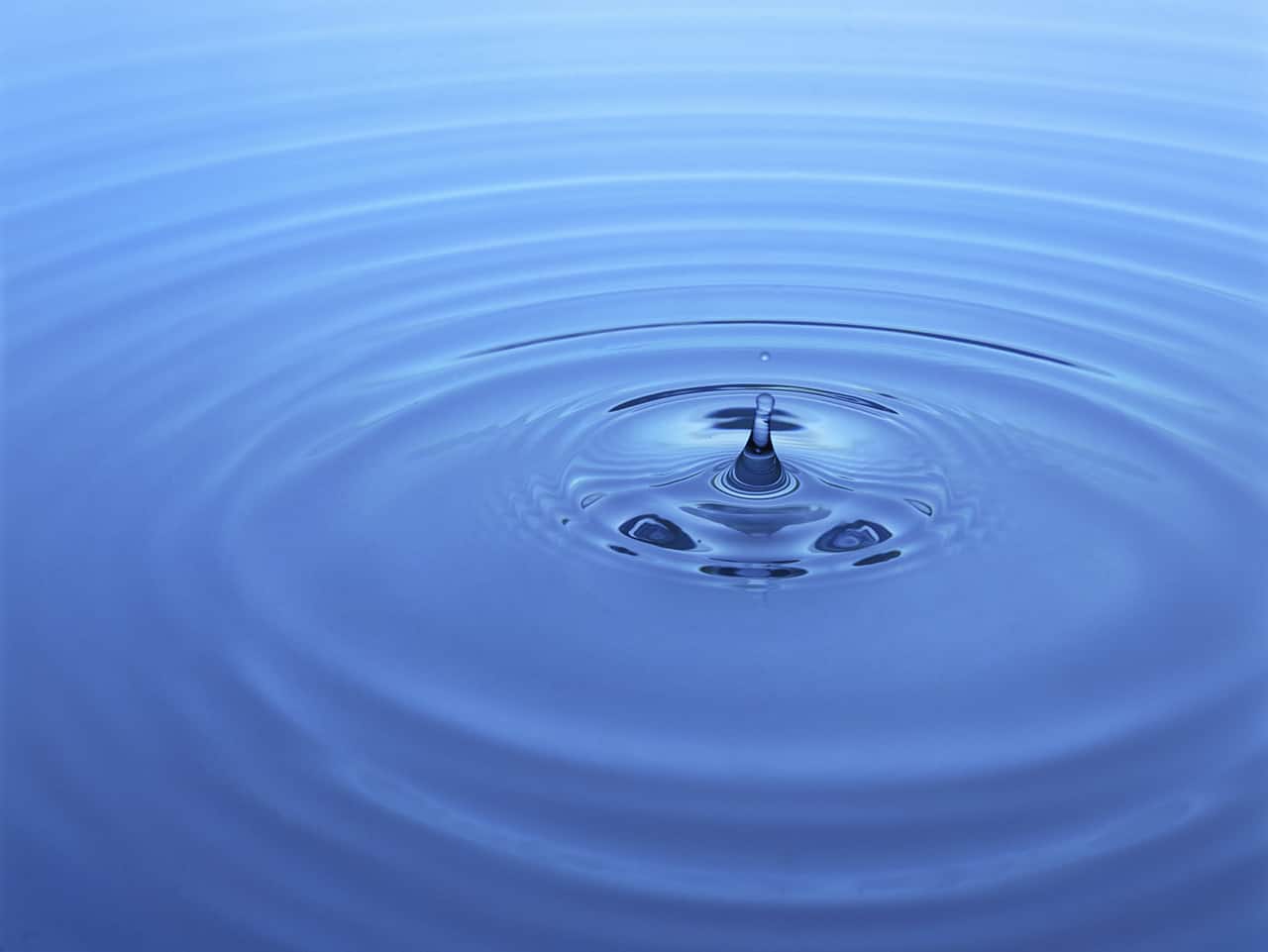 one drop of water in a blue pool