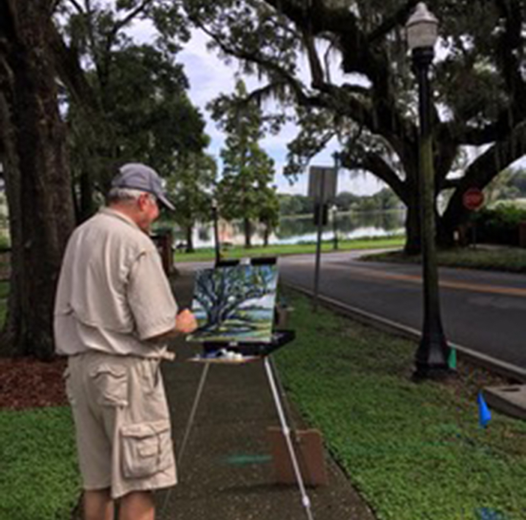 Wayne Chunat painting en plein air at the Lovers Tree on Success in Lakeland.